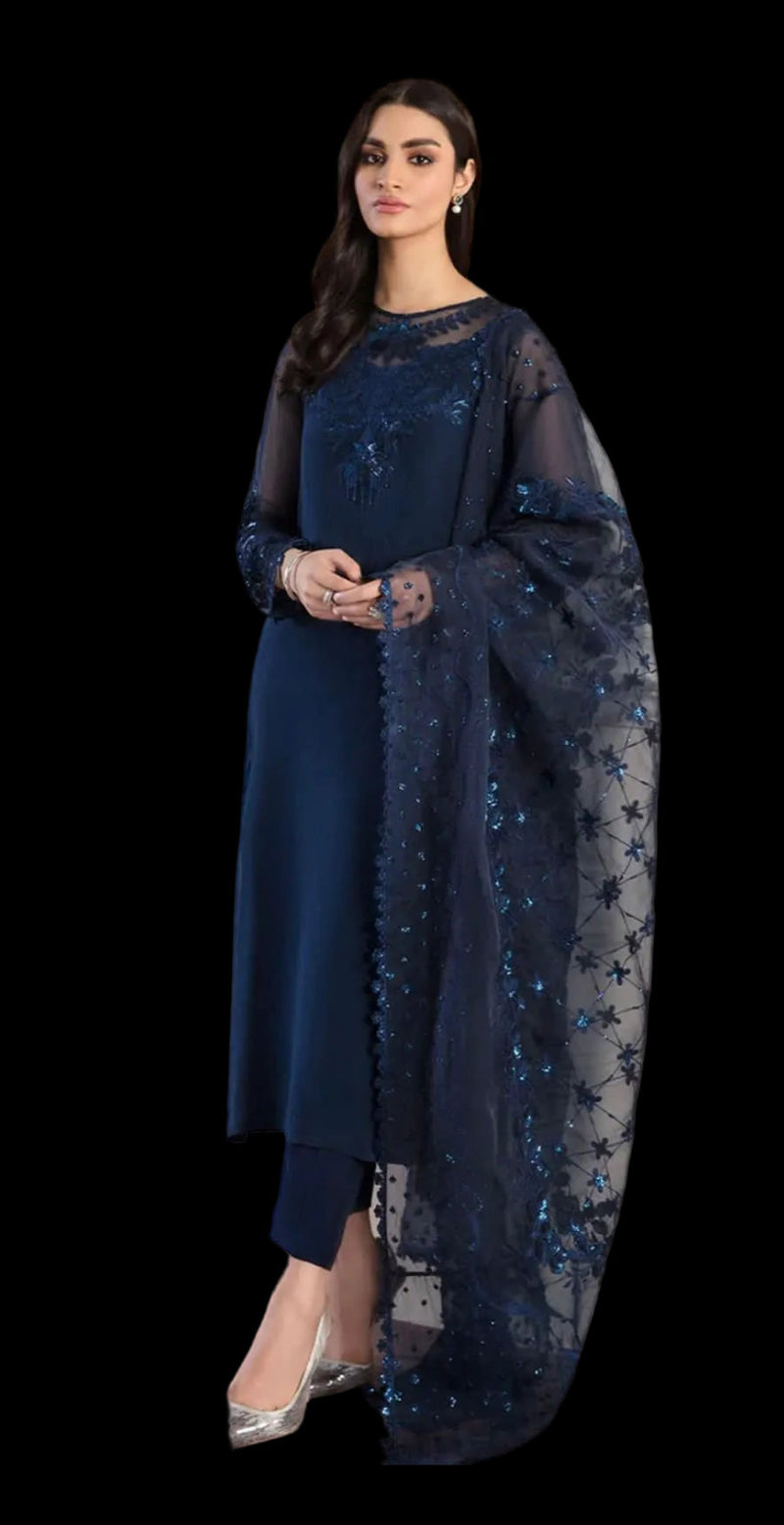 Woman wearing a dark blue embroidered outfit with a matching dupatta on a white background