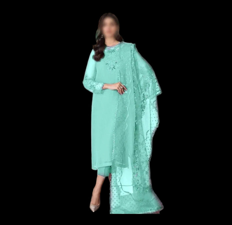 Person wearing a light blue traditional outfit with a matching dupatta against a neutral background